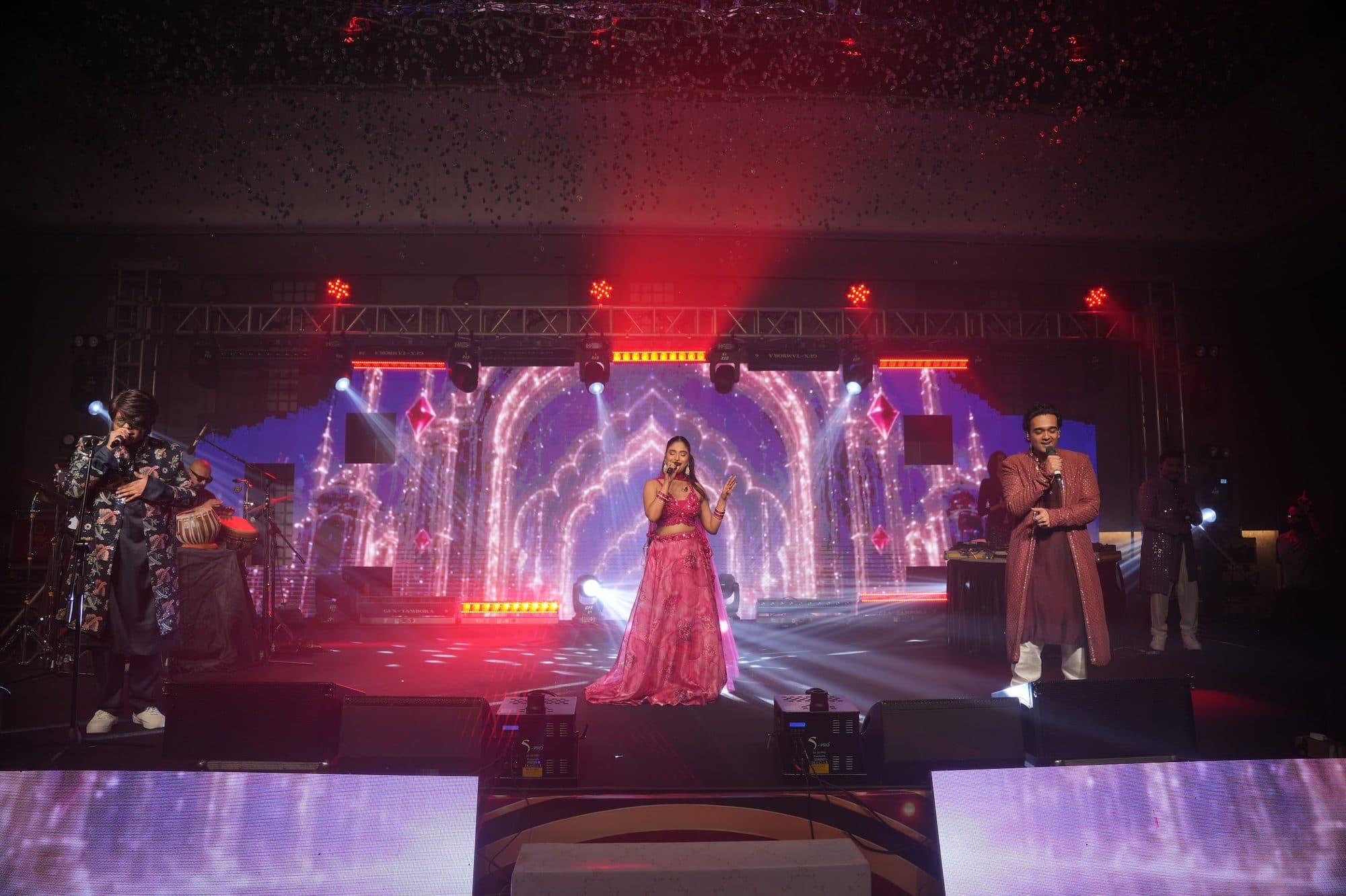 The full Mehfil X line-up across the stage, palace-arch visuals behind