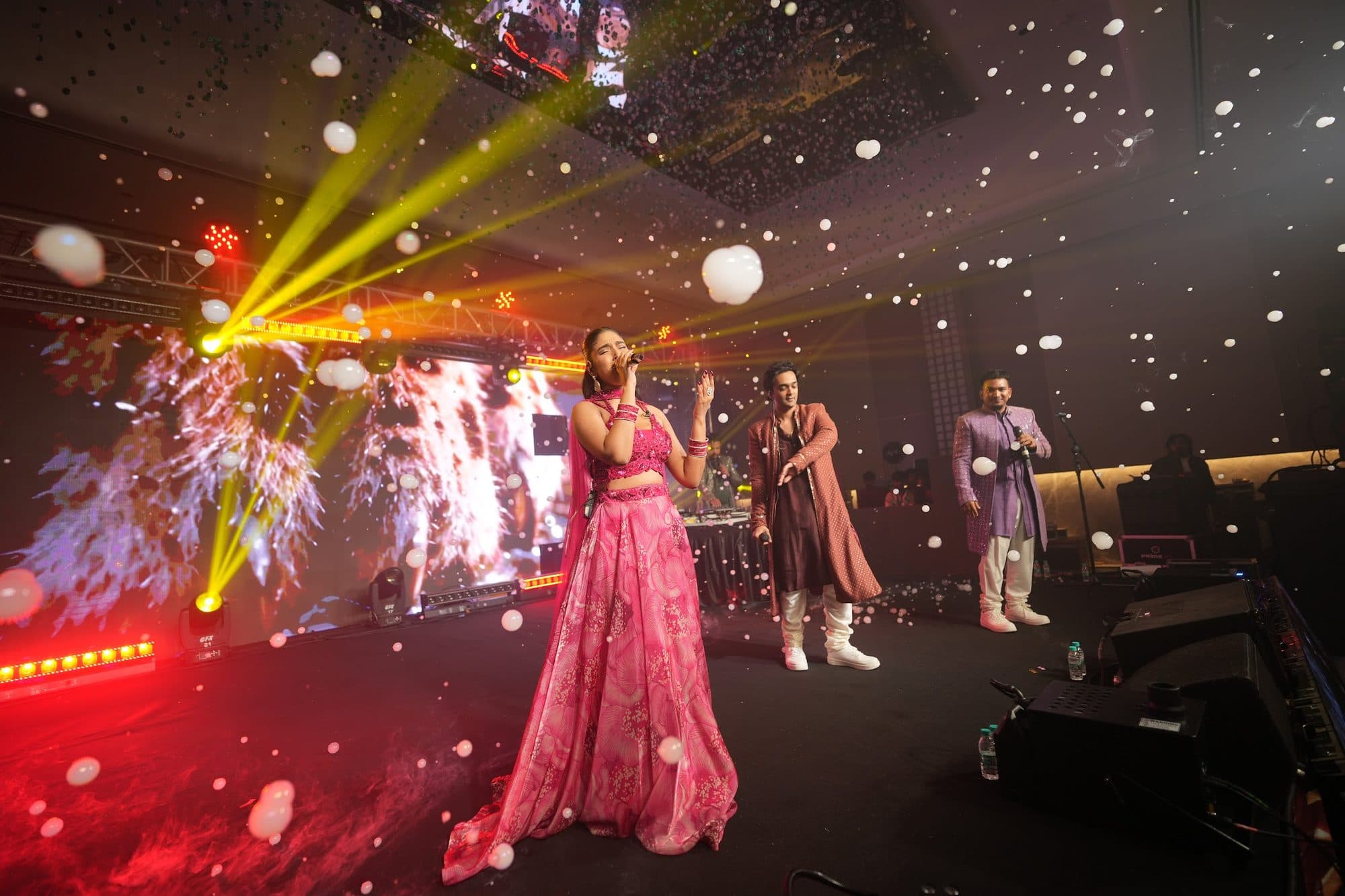 The Mehfil X line-up on stage under yellow beams and confetti